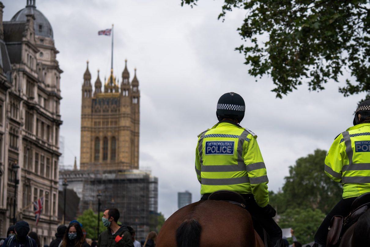 two policemen sit on horses getting ready for the right to strike protest
