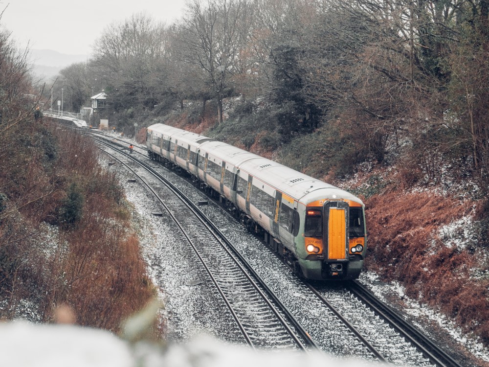 a uk train that is not on strike travels through the country side