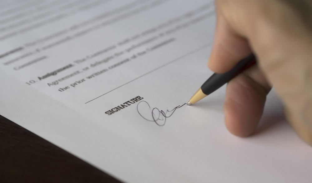 signing a document for offences