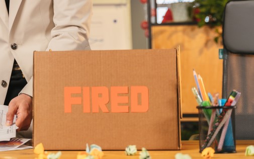a box with fired written on it sits on top of a desk