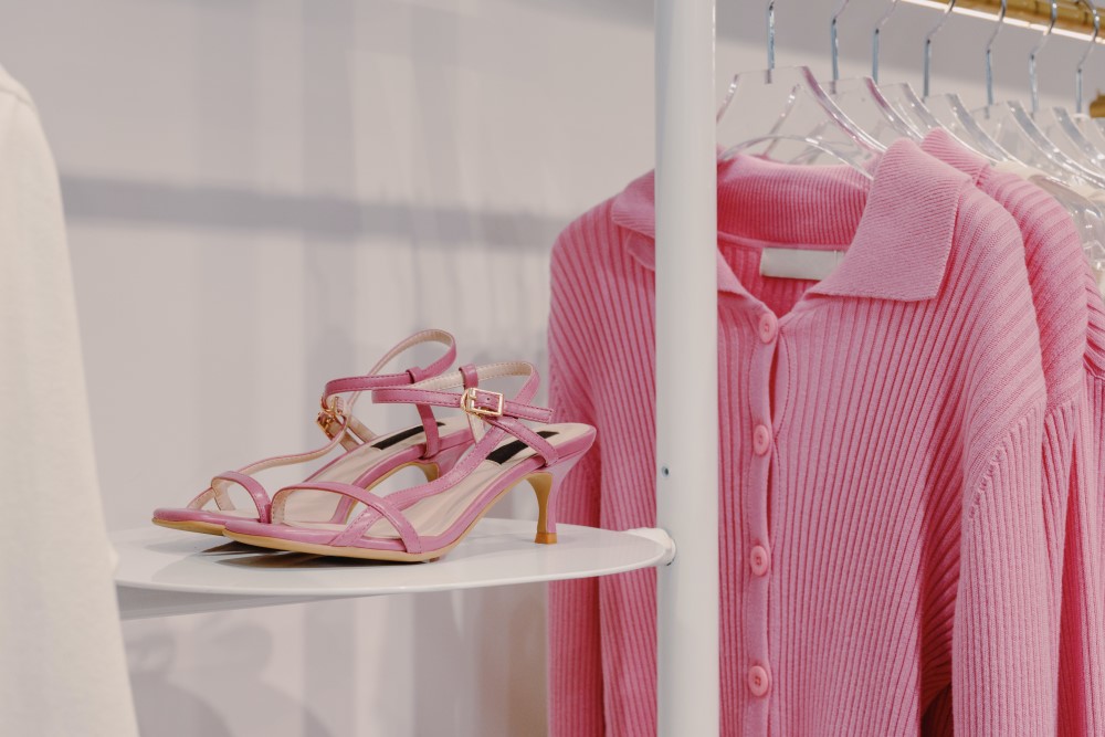 a women's cloth shop with pink shoes and cardigan